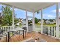 Screened porch with wooden deck, outdoor furniture, and a view of a backyard at 1617 Bowsprit Ct, Mount Pleasant, SC 29466