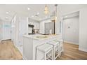 Modern kitchen with white cabinets and island at 2262 Folly Rd # 2-K, Charleston, SC 29412