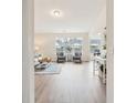 Spacious living room with hardwood floors, large windows, and comfortable seating at 232 Mallory Dr, Charleston, SC 29414