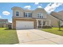 Two-story house with stone accents, a front porch, and a well-maintained lawn at 238 Wathen Dr, Goose Creek, SC 29445