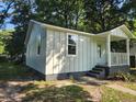Renovated cottage with new siding and landscaping at 2664 Hull St, North Charleston, SC 29405
