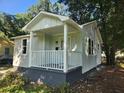 Newly painted light green house with a white porch at 2664 Hull St, North Charleston, SC 29405