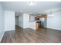 Open kitchen with stainless steel appliances and wood cabinets at 275 Jackson St, Goose Creek, SC 29445