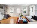 Light-filled living room featuring hardwood floors and modern decor at 301 Broad St # 1, Charleston, SC 29401