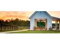 Relaxing gazebo overlooking a serene lake with wooden picnic tables at 323 Hillman Trl Dr, Moncks Corner, SC 29461