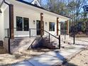 Front porch features brick columns,cable railing, and steps at 3874 Srevir Rd, Johns Island, SC 29455