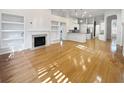 Open concept living space with hardwood floors and a fireplace at 606 Pointe Of Oaks Rd, Summerville, SC 29485