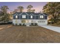 Two-story home with a white brick and gray siding exterior at 970 Lansing Dr, Mount Pleasant, SC 29464
