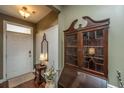 Bright entryway with antique cabinet and hardwood floors at 104 Pavilion St, Summerville, SC 29483
