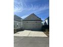 Two-car garage with light gray exterior and white doors at 106 Helena Park Dr Dr, Summerville, SC 29486