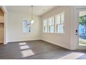 Bright dining room with hardwood floors and multiple windows at 2837 Auldreeke Rd, Johns Island, SC 29455