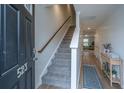 Bright entryway with carpeted stairs and tasteful decor at 523 Truman Dr, Goose Creek, SC 29445
