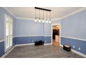 Spacious dining room with hardwood floors and two-toned walls at 8245 Governors Walk, North Charleston, SC 29418