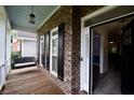 Inviting front porch with a swing and view of the entrance at 8245 Governors Walk, North Charleston, SC 29418