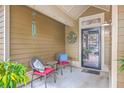 Cozy front porch with seating for two at 8382 Camp Gregg Ln, North Charleston, SC 29418
