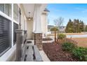 Front porch with a stone column and a wooden bench at 126 Veranda Dr, Summerville, SC 29485