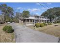 Two-story house with a long driveway and carport at 1520 Acacia St, Charleston, SC 29407