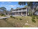 Two-story house with a porch and landscaped yard at 1520 Acacia St, Charleston, SC 29407