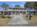 Two-story house with a porch and driveway at 1520 Acacia St, Charleston, SC 29407