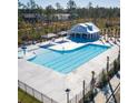 Community swimming pool with a separate splash pad and covered seating area at 189 W Bradford Pointe Dr, Summerville, SC 29486