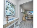 Bright entryway with coastal-themed decor and view into living room at 310 Bloomington Way, Summerville, SC 29486