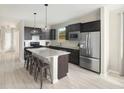 Modern kitchen featuring stainless steel appliances and an island at 723 Blue Iris Way, Summerville, SC 29486