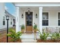 Inviting front door entry with a welcoming porch at 1245 Crooked Oak Rd, Charleston, SC 29492