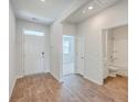 Bright entryway with wood-look floors and view into adjacent bathroom and room at 133 Summit View Dr, Summerville, SC 29486