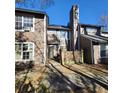 Two-story townhome with brown siding and small patio at 138 Luden Dr # C, Summerville, SC 29483