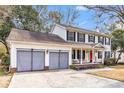 Two-story house with double garage and gray screen doors at 1960 Pinehurst Ave, Charleston, SC 29414