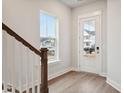 Bright entryway with hardwood floors, staircase, and front door at 199 Denham St, Summerville, SC 29486