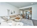 Open concept living area with sectional sofa and access to dining area at 2910 Clearwater Dr, Mount Pleasant, SC 29466