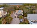 Aerial view of beach house and surrounding neighborhood at 904 E Arctic Ave, Folly Beach, SC 29439