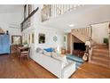Cozy living room featuring hardwood floors and a comfortable sofa at 904 E Arctic Ave, Folly Beach, SC 29439