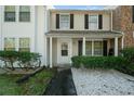 Front view of charming townhome with stone pathway at 1101 Reserve Way, Summerville, SC 29485