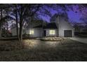 Updated gray house exterior at night, nicely lit at 117 Hummingbird Ave, Ladson, SC 29456