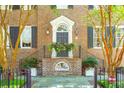 Elegant front entrance with a brick staircase and decorative detailing at 149 S Battery St, Charleston, SC 29401