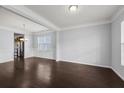 Spacious dining room with dark hardwood floors and a chandelier at 187 Weeping Cypress Dr, Moncks Corner, SC 29461