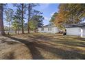 Large backyard with grassy area and trees at 2108 Ridge Church Rd # A & B, Summerville, SC 29486
