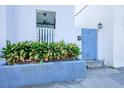 Blue gate and planter lead to the front entrance at 25 Sheppard St, Charleston, SC 29403