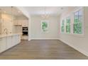 Bright dining area with hardwood floors and large windows at 2841 Auldreeke Rd, Johns Island, SC 29455