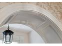Detailed arched doorway with gray paneling and decorative molding at 43 Hasell St, Charleston, SC 29401