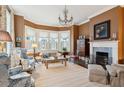 Spacious living room with bay windows, a fireplace, and comfortable seating at 43 Hasell St, Charleston, SC 29401