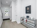 Bright entryway with hardwood floors and console table at 225 Witherspoon St, Summerville, SC 29486