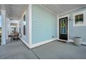 Front porch with black door and light blue siding at 225 Witherspoon St, Summerville, SC 29486