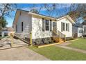 Recently updated home with a modern exterior and well-manicured lawn at 2943 Alabama Dr, North Charleston, SC 29405