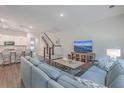 Spacious living room with comfortable sectional sofa and large flat-screen TV at 3012 Emma Ln, Mount Pleasant, SC 29466