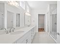 White bathroom with double vanity and glass shower at 418 Evening Glow Ln, Summerville, SC 29486