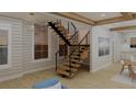 Modern floating staircase with wood treads and metal railing at 420 Greenwich St, Mount Pleasant, SC 29464