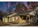 Newly renovated brick ranch house with carport and updated landscaping at 7640 Hillview Ln, North Charleston, SC 29420